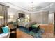 A luxurious main bedroom with a large bed, tray ceilings, natural light, and custom decor at 12627 Ninebark Trl, Charlotte, NC 28278
