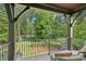 Scenic backyard view from the covered patio, showcasing lush greenery at 1407 Becklow Ct, Wesley Chapel, NC 28079