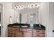 Well-lit bathroom features a granite countertop, updated fixtures, and a large mirror at 1407 Becklow Ct, Wesley Chapel, NC 28079