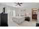 Bedroom filled with natural light with neutral decor and a cozy window nook at 1407 Becklow Ct, Wesley Chapel, NC 28079