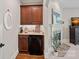 Chic coffee bar nook featuring a mini-fridge, granite countertop, and custom cabinetry at 1407 Becklow Ct, Wesley Chapel, NC 28079