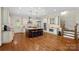 Well-equipped kitchen with a spacious center island, stainless steel appliances, and wood flooring at 1407 Becklow Ct, Wesley Chapel, NC 28079