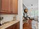 Stylish dry bar leading into living area with fireplace at 1407 Becklow Ct, Wesley Chapel, NC 28079