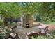 Outdoor area featuring an in-ground pool, fireplace, and seating area at 1407 Becklow Ct, Wesley Chapel, NC 28079