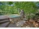 Custom pool features stone work, outdoor fireplace, and deck at 1407 Becklow Ct, Wesley Chapel, NC 28079