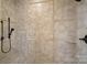 Detailed tile work with an elegant design accents the walk-in shower at 1407 Becklow Ct, Wesley Chapel, NC 28079