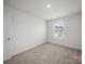 Light-filled bedroom with a view from the window and plush carpeting at 14217 Wilson Mac Ln, Charlotte, NC 28278