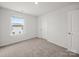Bedroom featuring a window, carpet flooring, and a neutral paint color at 14217 Wilson Mac Ln, Charlotte, NC 28278