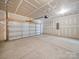Spacious two-car garage with concrete flooring and plenty of room for storage at 14217 Wilson Mac Ln, Charlotte, NC 28278