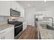 Modern kitchen features stainless steel appliances, a gas range, and sleek countertops at 14217 Wilson Mac Ln, Charlotte, NC 28278