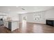 Open concept kitchen with granite countertops, modern stainless steel appliances, and hardwood floors at 14217 Wilson Mac Ln, Charlotte, NC 28278