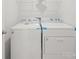 The laundry room features modern white washer and dryer units at 14217 Wilson Mac Ln, Charlotte, NC 28278