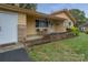 Charming front porch with seating and landscaped flower bed at 143 W College St, Stanley, NC 28164