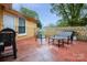 Relaxing outdoor patio with seating area and grilling space at 143 W College St, Stanley, NC 28164