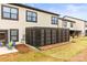 Home exterior boasts a screened patio area and well-maintained backyard at 154 Shields Dr, Lincolnton, NC 28092