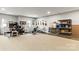 A finished basement with exercise equipment, desk, and guitar-themed decor at 154 Shields Dr, Lincolnton, NC 28092