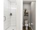 Modern bathroom featuring a shower and a stylishly decorated adjacent powder room at 154 Shields Dr, Lincolnton, NC 28092