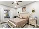 This primary bedroom features a ceiling fan, rug, and large window offering natural light at 154 Shields Dr, Lincolnton, NC 28092
