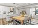 An open concept floor plan showing dining room with a kitchen and island in background at 154 Shields Dr, Lincolnton, NC 28092