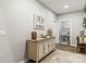 Welcoming entryway featuring a wood cabinet and a view into the laundry room, decorated with stylish accents at 154 Shields Dr, Lincolnton, NC 28092