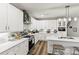 Modern kitchen featuring white cabinetry, stainless steel appliances, and hardwood floors at 154 Shields Dr, Lincolnton, NC 28092