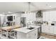 Bright kitchen with white cabinets, stainless steel appliances, a marble island, and an adjacent dining area at 154 Shields Dr, Lincolnton, NC 28092