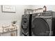 Laundry room featuring modern washer and dryer, adding convenience to daily chores at 154 Shields Dr, Lincolnton, NC 28092