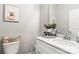 Cute powder room with a pedestal sink, marble countertop, and decorative wall art at 154 Shields Dr, Lincolnton, NC 28092