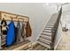 Staircase with carpeted treads and dark metal spindles, next to a 'Welcome' sign and coat hooks at 154 Shields Dr, Lincolnton, NC 28092