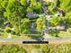 Aerial view of property with tree coverage, and approximate .37 acre lot at 1628 Rosegate Ln, Stanfield, NC 28163