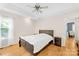 This bedroom features a light color palette, a queen bed, hardwood floors and natural light at 1628 Rosegate Ln, Stanfield, NC 28163