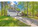 Charming single-Gathering home with attached garage, well-maintained lawn, and long paved driveway at 1628 Rosegate Ln, Stanfield, NC 28163