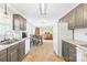 Well-lit kitchen that offers views into the dining area and living room at 1628 Rosegate Ln, Stanfield, NC 28163