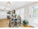 Cozy breakfast nook with a dining table, complemented by a plant and lots of natural light at 1628 Rosegate Ln, Stanfield, NC 28163