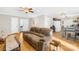 Open-concept living room flowing into the kitchen and dining area, featuring hardwood floors at 1628 Rosegate Ln, Stanfield, NC 28163
