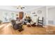 Comfortable living room with hardwood floors, a ceiling fan, and a neutral color palette at 1628 Rosegate Ln, Stanfield, NC 28163
