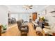 Bright living room featuring wood floors, a ceiling fan, and a view into the dining area at 1628 Rosegate Ln, Stanfield, NC 28163