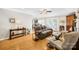 Cozy living room with hardwood floors and a seamless flow into the kitchen and dining area at 1628 Rosegate Ln, Stanfield, NC 28163