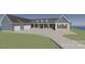 Inviting exterior showcasing a two-car garage, stone accents, and a well-manicured lawn at 2296 Bridgewater Rd # 2, Rock Hill, SC 29730
