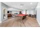 Spacious finished basement featuring a pool table, ping pong, wet bar, and luxury vinyl plank flooring at 233 Conifer Way, Shelby, NC 28150