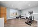 Finished basement featuring an exercise area with equipment, a window with views, and luxury vinyl plank flooring at 233 Conifer Way, Shelby, NC 28150
