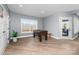 Finished basement featuring a foosball table, large windows with views, and luxury vinyl plank flooring at 233 Conifer Way, Shelby, NC 28150