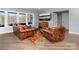 Finished basement featuring a lounge area with comfortable furniture, tv, and luxury vinyl plank flooring at 233 Conifer Way, Shelby, NC 28150
