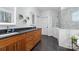Modern bathroom featuring a double vanity, a glass-enclosed shower, and sleek tile flooring at 233 Conifer Way, Shelby, NC 28150