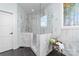 Bright bathroom featuring marble shower with glass surround and accent table at 233 Conifer Way, Shelby, NC 28150