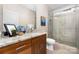 Modern bathroom with wood vanity, granite counters and glass door shower at 233 Conifer Way, Shelby, NC 28150