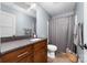 Modern bathroom featuring updated vanity and fixtures, tile flooring, and neutral paint at 233 Conifer Way, Shelby, NC 28150