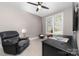 Cozy bedroom featuring reading chair, desk and window views at 233 Conifer Way, Shelby, NC 28150