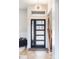 Grand front door entry with transom window and modern glass, offering natural light and a welcoming atmosphere at 233 Conifer Way, Shelby, NC 28150