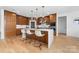 Modern kitchen featuring wood cabinets, a large island with seating, and stainless steel appliances at 233 Conifer Way, Shelby, NC 28150